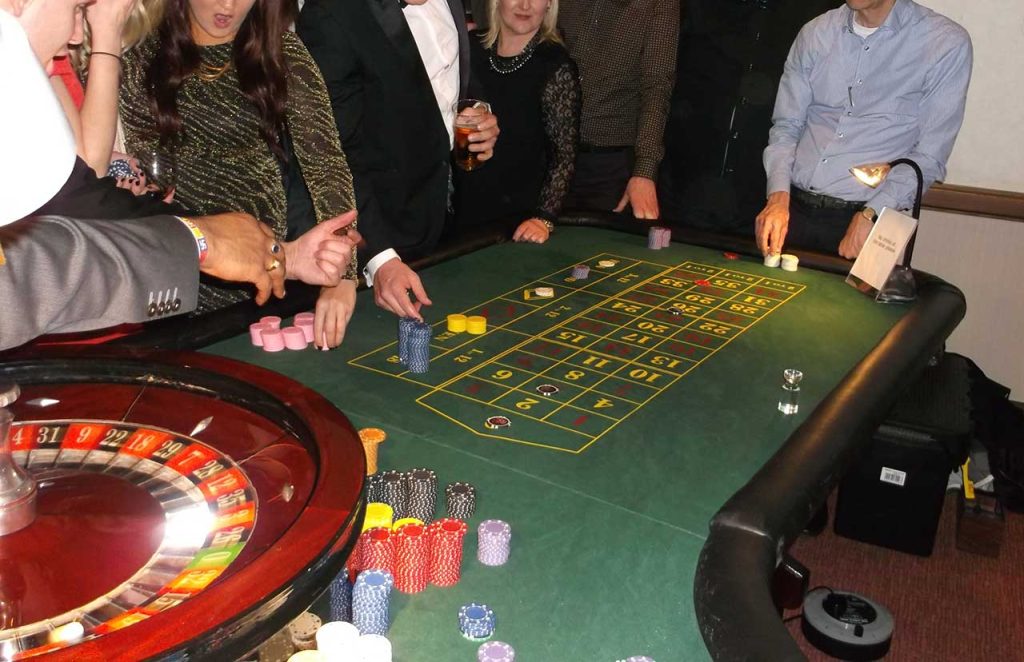 The table and wheel in use at a fun casino event